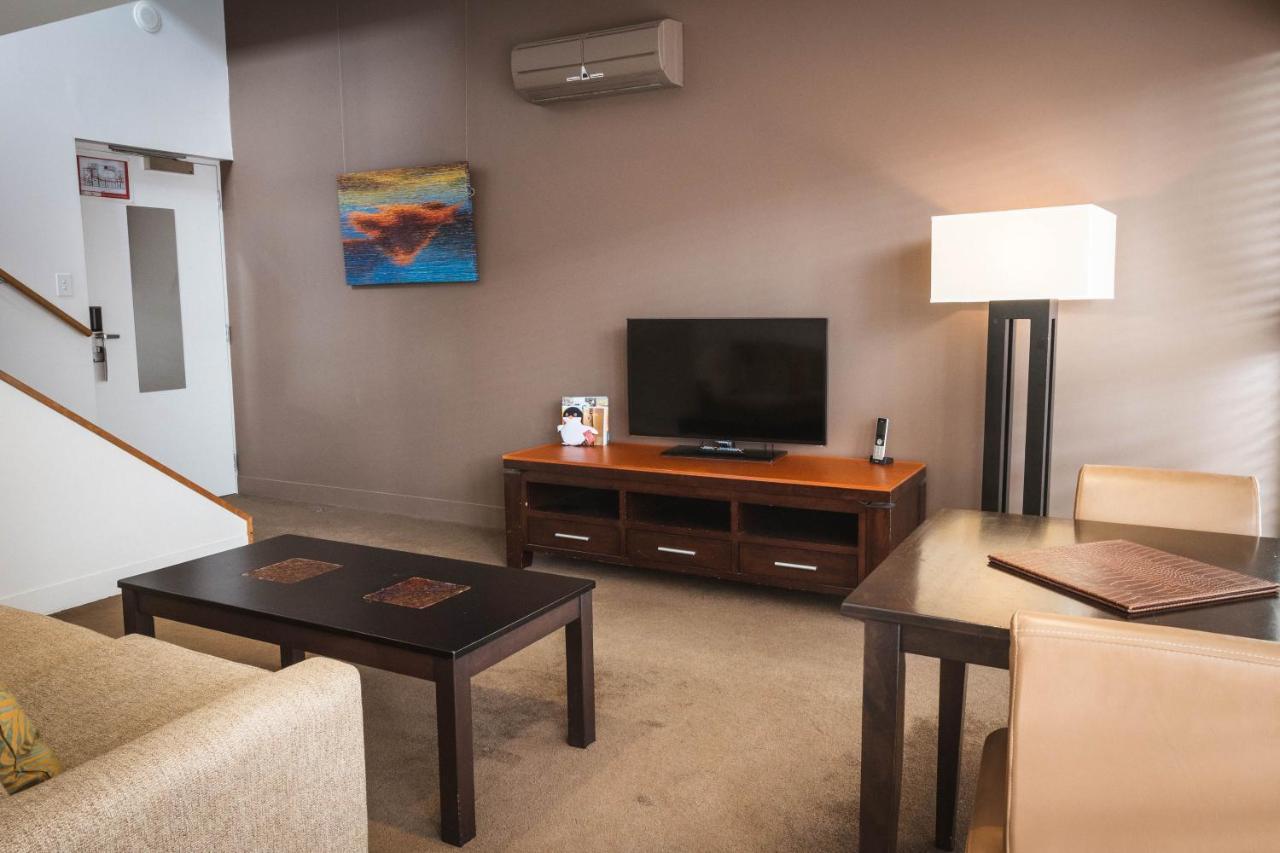 The Henry Jones Art Hotel Hobart Exteriör bild A living room in a typical apartment at the Village at Grand Traverse Commons